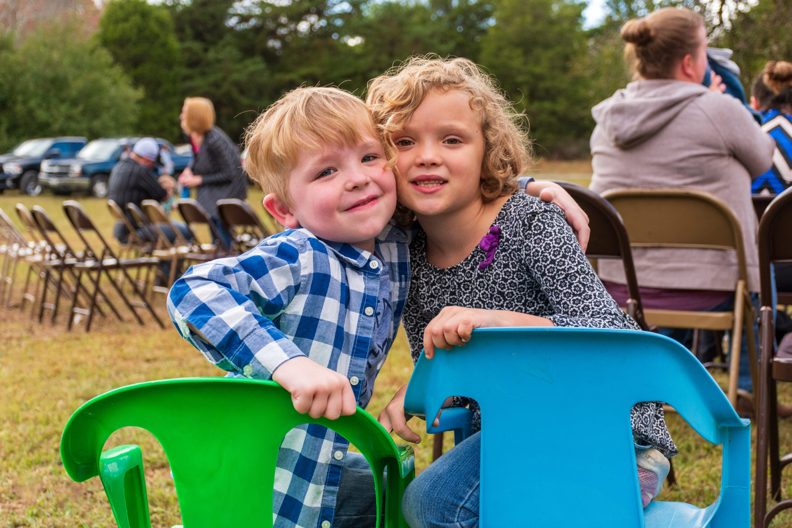 2 Children in chairs Hugging