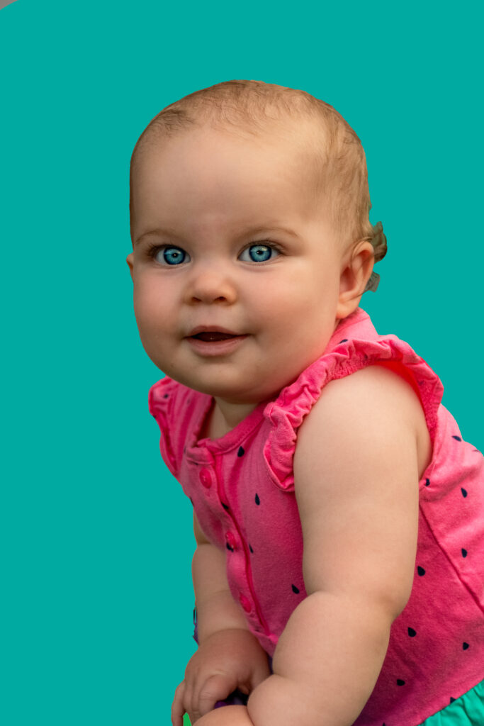 Child in Pink With Light Blue BG